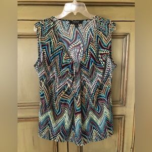 Sleeveless multi color blouse.